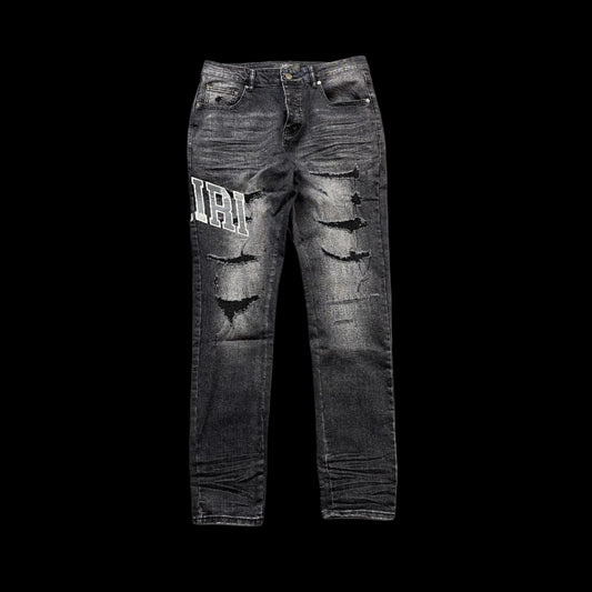 AMIRI VARSITY LOGO REPAIR JEANS
